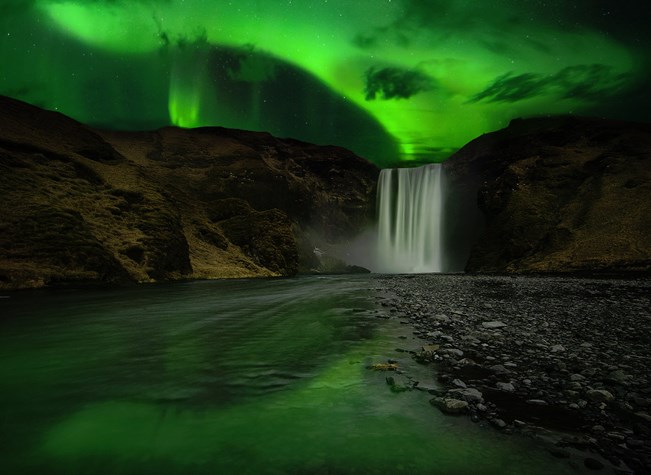 Aurora Borealis above Skógafoss in South Iceland