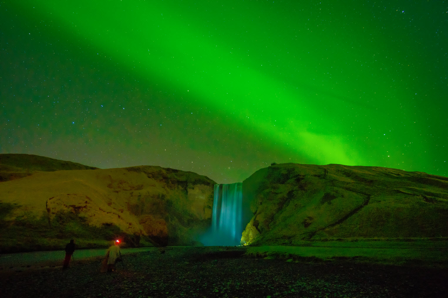 Aurora Borealis visible over Skógafoss in South Iceland.