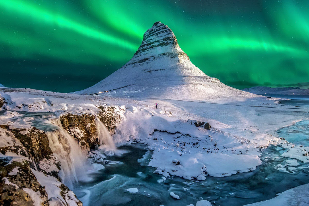 Kirkjufell at winter time with Northern Lights