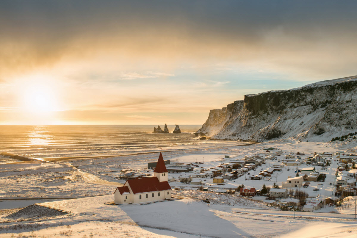 View over the town Vík with the sunset