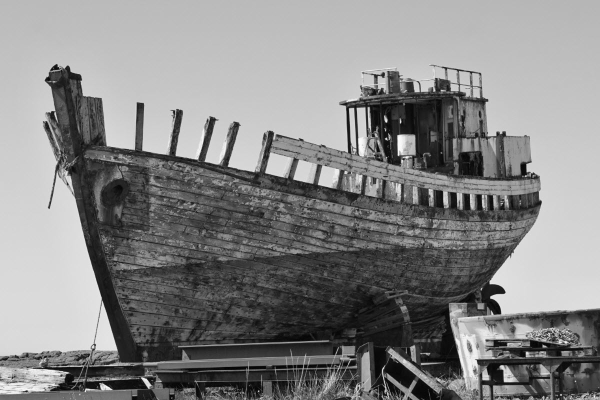 Old rusty wooden shipwreck in Akranes Iceland