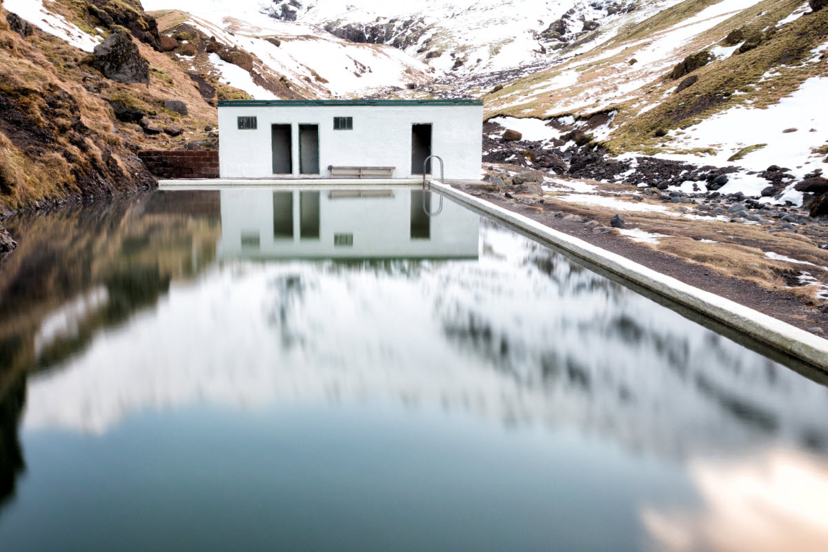 Seljavallalaug natural swimming pool during winter in South Iceland