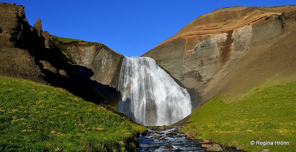 A waterfall on a sunny day